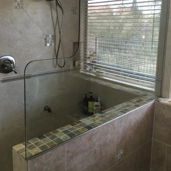 Remodeled bathroom with a glass shower enclosure and tile, Complete Kitchen & Bath