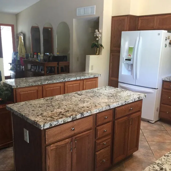 Remodeled kitchen with a granite island, Complete Kitchen & Bath