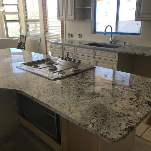 Remodeled kitchen with quartz countertops and a cooktop island, Complete Kitchen & Bath